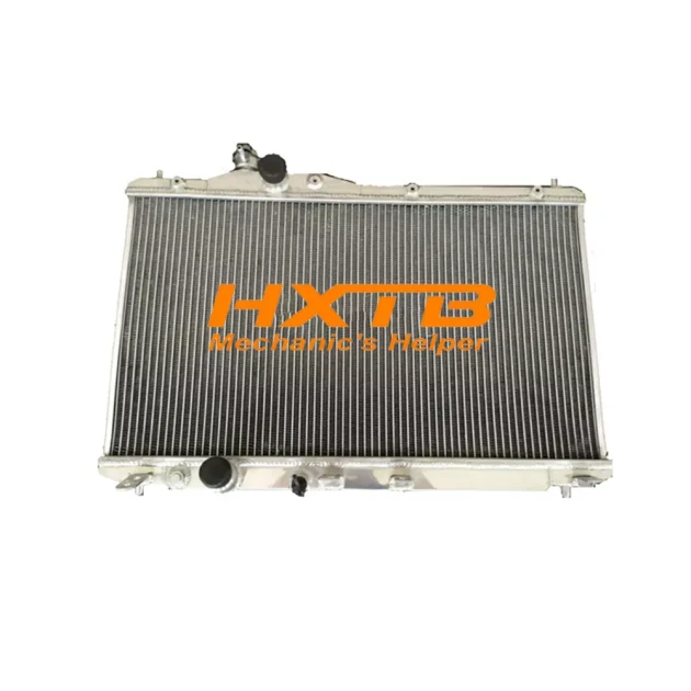 Aluminum radiator for Honda Civic FB 1.8L (2012-2014), manual transmission, with mounting brackets and inlet/outlet ports visible